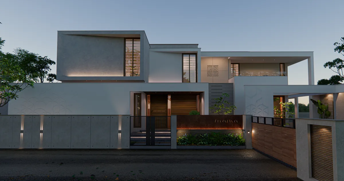 Long two-storey home set back behind a low boundary wall along the road, with lights in the wall and a gate at the end