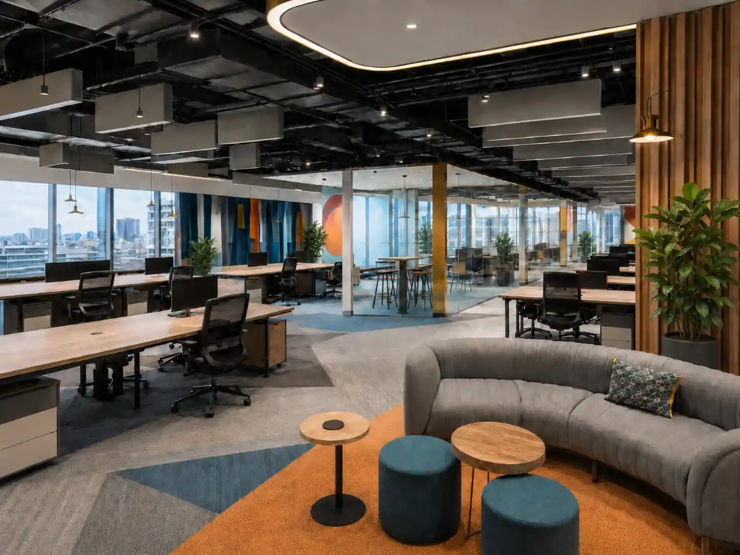 Office breakout lounge curved sofa seating at Intellivra, Kerala