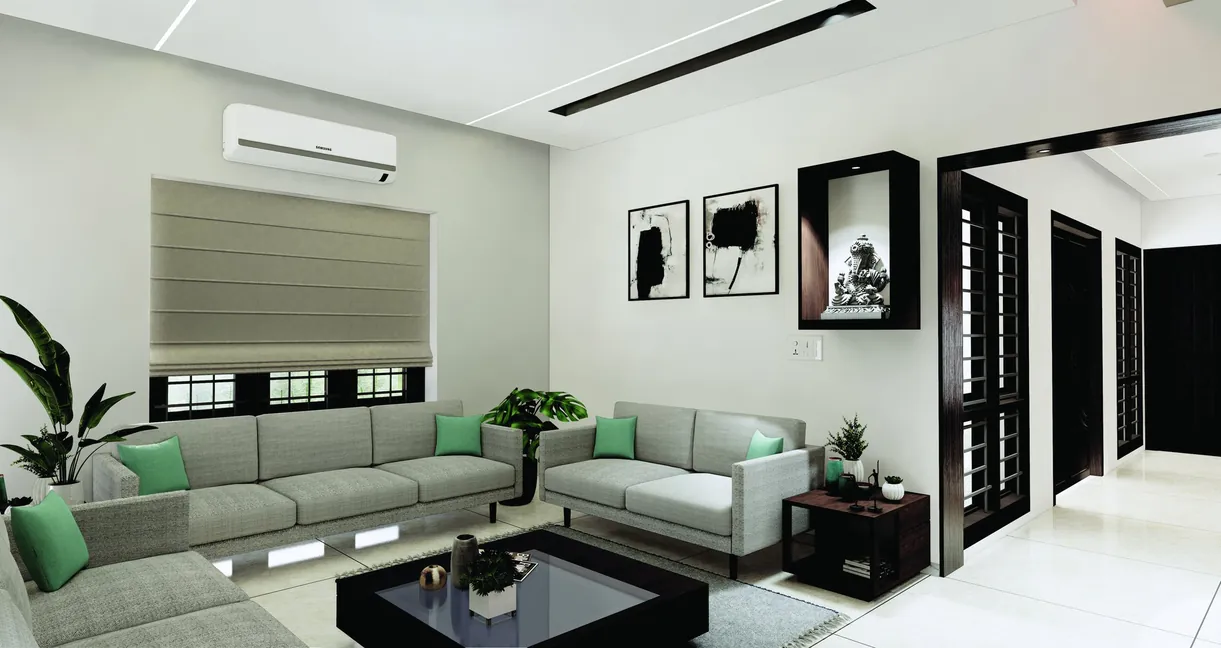 Living room with grey sofas and framed artwork, Akkulam, Trivandrum - interior design by Radianz, architects in Trivandrum