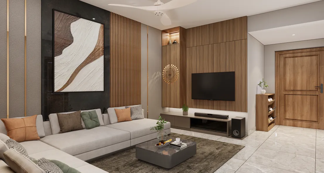 Living room with wood-panelled TV wall and sectional sofa, Poojapura, Trivandrum - interior design by Radianz, architects in Trivandrum
