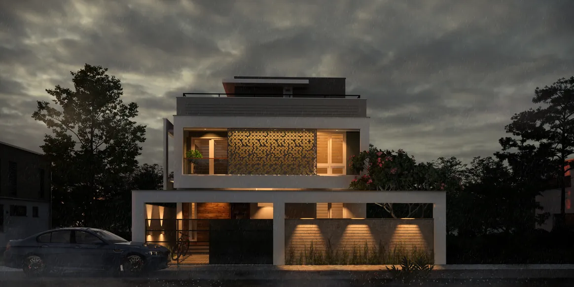 Modern house at night, its first-floor jaali screen glowing above a lit carport, Pangappara, Trivandrum