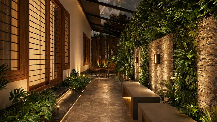Side courtyard with a planted green wall, stone cladding, timber screens and a bench along the path
